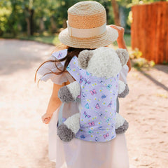 18INDC Child using the carrier outdoors for portable doll adventures.