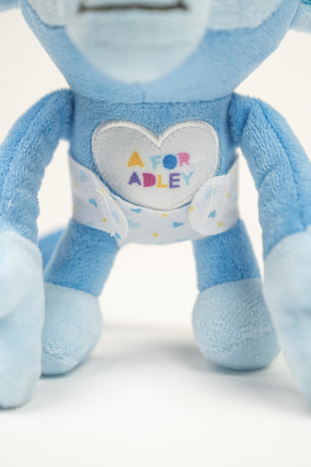 A FOR ADLEY soft plush texture invites gentle hugs and comfort.