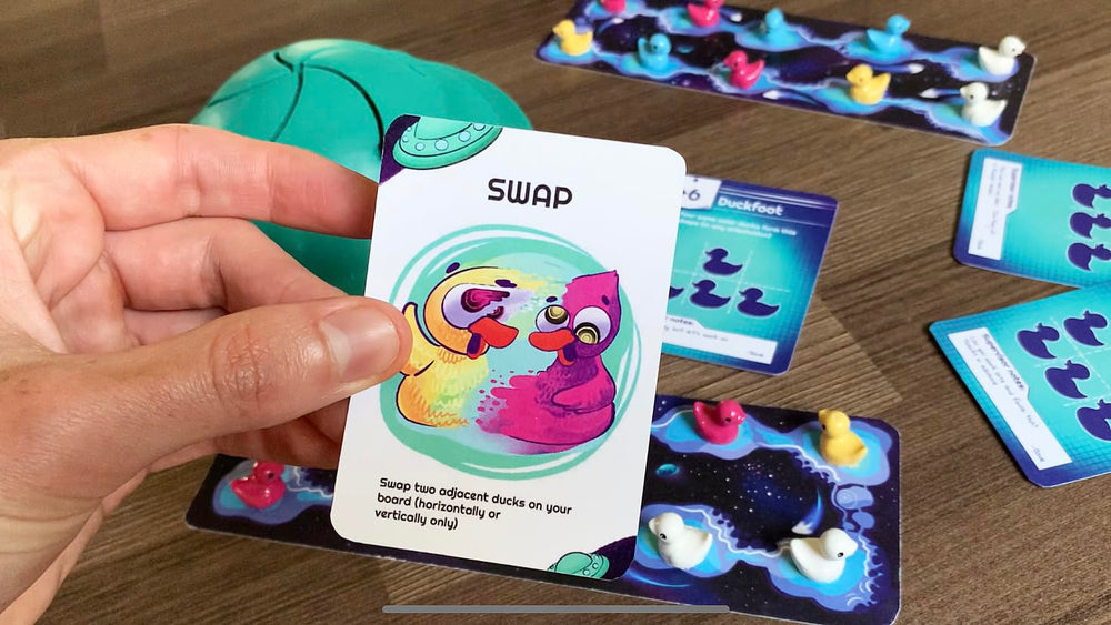 Abducktion IntergalacDuck challenging formation cards in action during play.