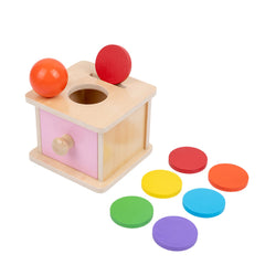 Adena Montessori coin box pink door with discs improves color recognition through tactile play.