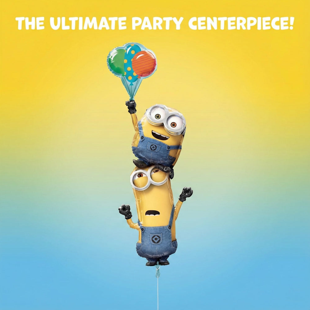 Anagram Minions Stacker Balloon accents the cake table setup.