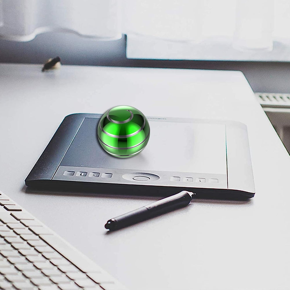 Apqdw kinetic desk toy ball on desk shows continuous spin during work.
