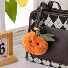 Apricot Lamb orange plush keychain close-up fabric, soft texture for comforting touch.