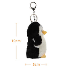 Apricot Lamb penguin keychain hanging on a bag, serves as a portable cuddle buddy.