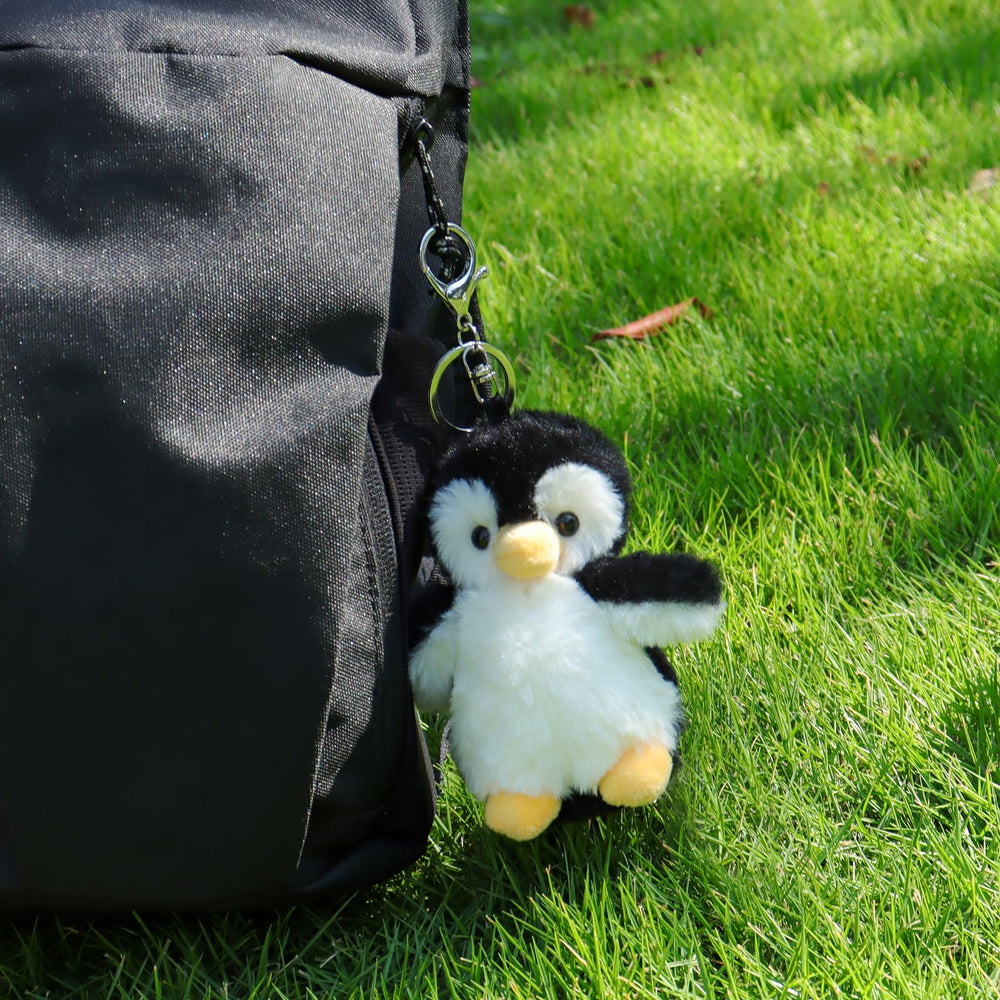Apricot Lamb penguin keychain on backpack, ideal as a bag accessory.