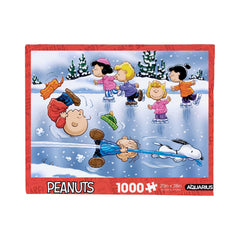 AQUARIUS Charlie Brown Christmas puzzle box front with vibrant Peanuts artwork for festive display.