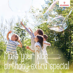 Giant bubbles soaring during a family outdoor bubble activity.
