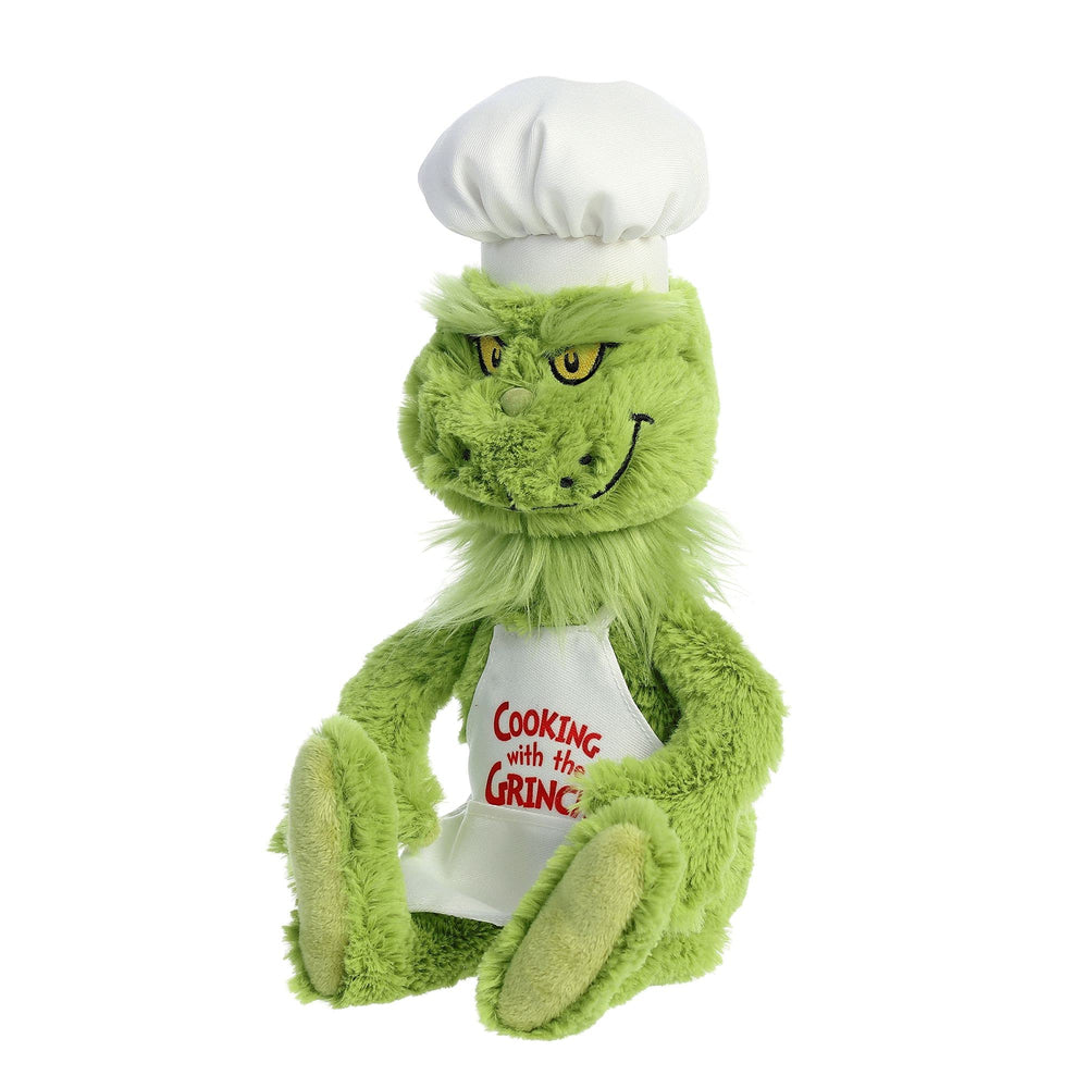Aurora Chef Grinch plush being held by a child for pretend play