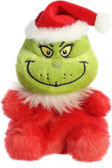 Aurora Palm Pals Santa Grinch plush hides in stockings for playful chaos.