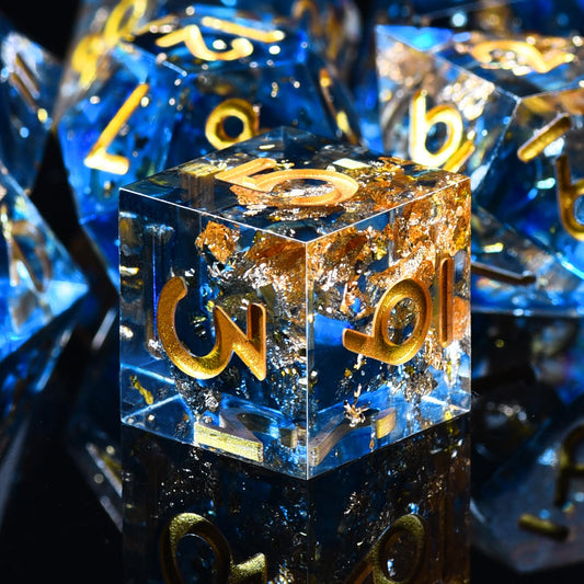 AUSTOR 7-Die DND dice set in translucent blue with gold sequins for eye-catching display.