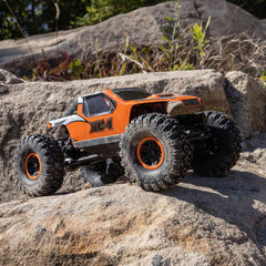 Axial AX24 XC-1 side profile with 4WS highlights precise control on uneven terrain.