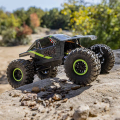 Axial AX24 XC-1 rock lizards tires offer rugged grip on varied trails.