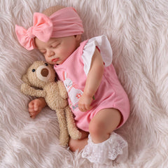 BABESIDE doll cradled in arms for comforting pretend play and companionship.