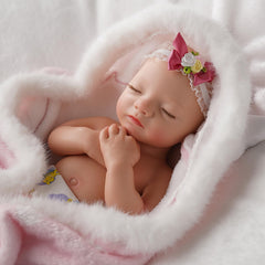 BABESIDE sleeping-face poseable limbs offer natural repose and display possibilities.