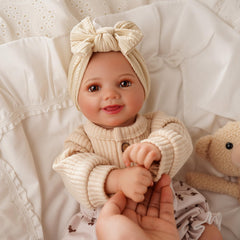 BABESIDE Sunny poseable limbs support natural cradle and play poses.