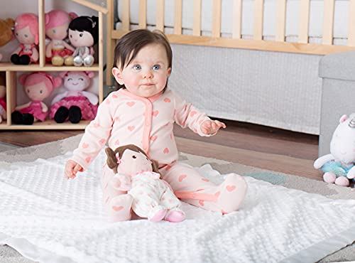 Close-up of Baby Starters Olivia plush doll showing rattle feature for baby entertainment