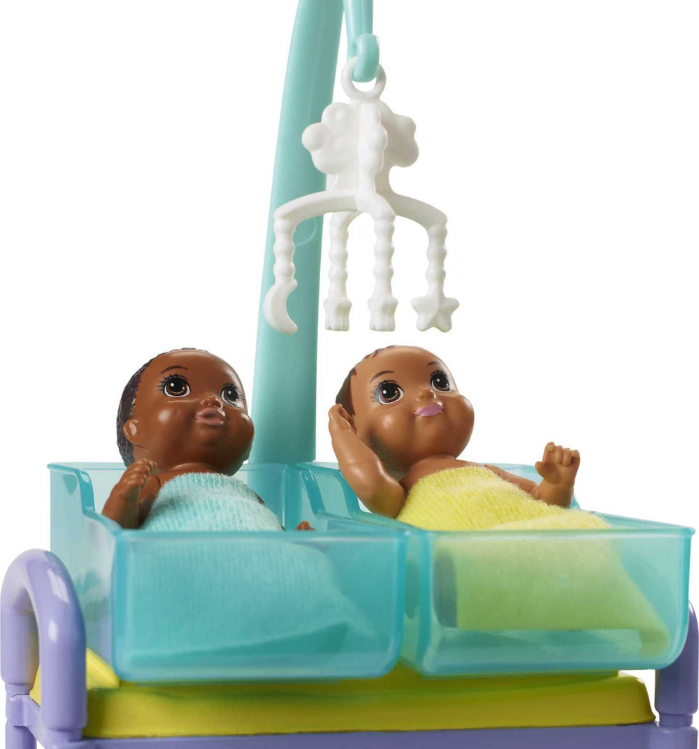 Barbie baby dolls wrapped in blankets invite comforting caretaking stories.