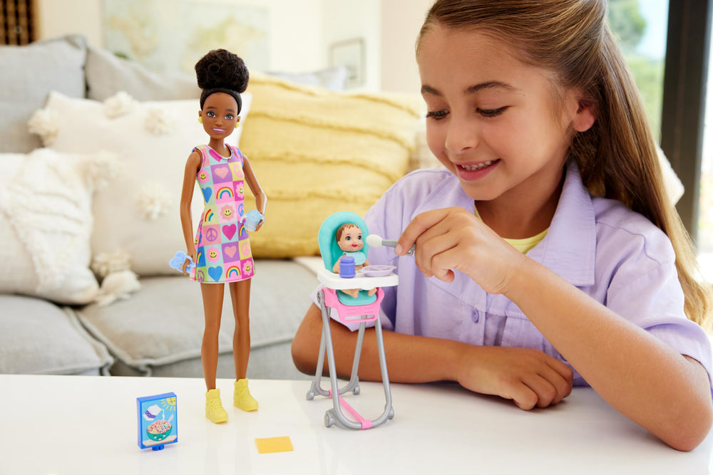 Barbie Skipper babysitters accessories around a highchair for feeding play.