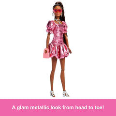 Barbie Deluxe Style Doll #6 wearing silver hoop earrings and layered necklace for glam detail.