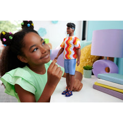 Barbie Ken in orange-pattern shirt showcasing bold fashion options