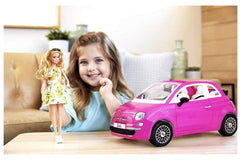 Barbie doll in lemon print dress ready to explore adventures.