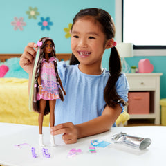 Barbie Fun & Fancy rainbow hair extension clip adds color and texture.