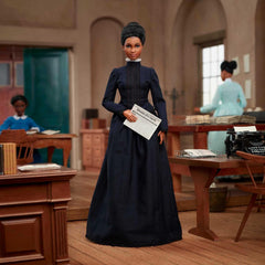 Barbie Ida B. Wells with newspaper accessory for educational display.