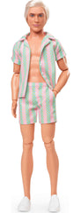 Barbie Ken doll's white sneakers enhance an authentic beach-ready look.