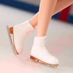 Silvery earrings and bouquet complete Kristi Yamaguchi Barbie's on-ice look.