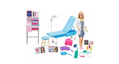 Barbie Medical Doctor Deluxe doll on exam table for imaginative care play.