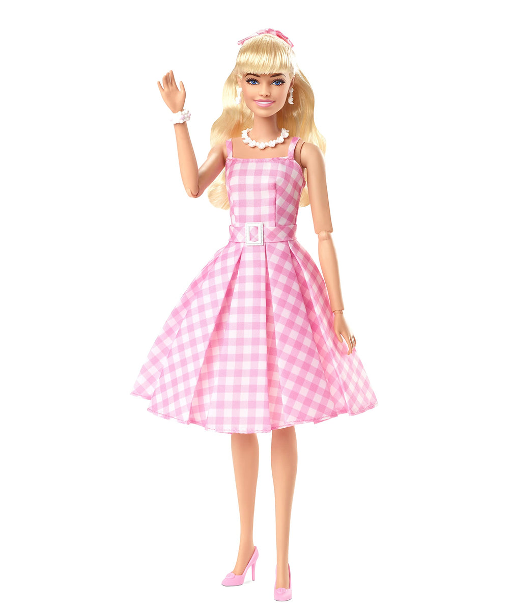 Barbie The Movie doll with half‑up hair and pink ribbon