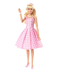 Barbie The Movie doll with half‑up hair and pink ribbon