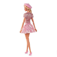 Barbie The Movie doll wears pearl earrings for a refined touch.
