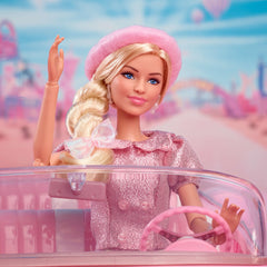 Barbie The Movie doll steps in pink heels for authentic styling.