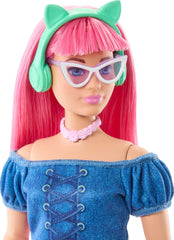 Barbie Mysteries Daisy wearing shimmery pink skirt and blue top for storytelling.