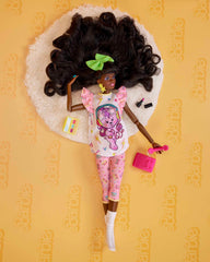 Barbie Rewind doll with big hair bow highlights 80s style at a sleepover