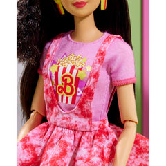 Barbie Rewind doll scrunchie highlights iconic black hair style.