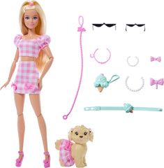 Sunglasses, necklaces, and bows complete coordinated Barbie-dog looks.