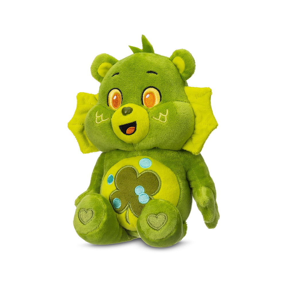 Good Luck Bear plush posed with cozy bedtime reading setup for cuddles
