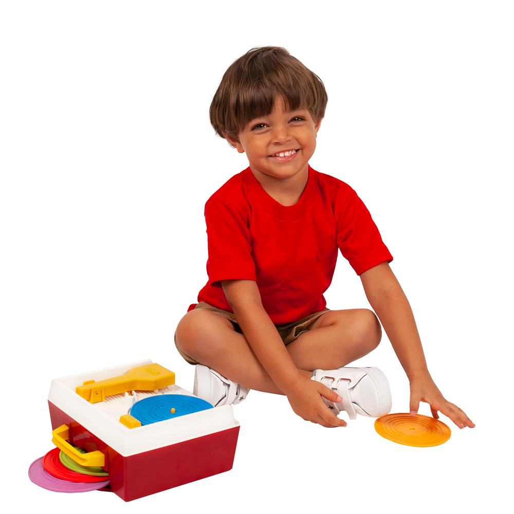 Child-focused scene of a kid playing with the Record Player.