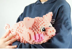 BDYDT pig micro building blocks with instruction book enabling guided assembly.