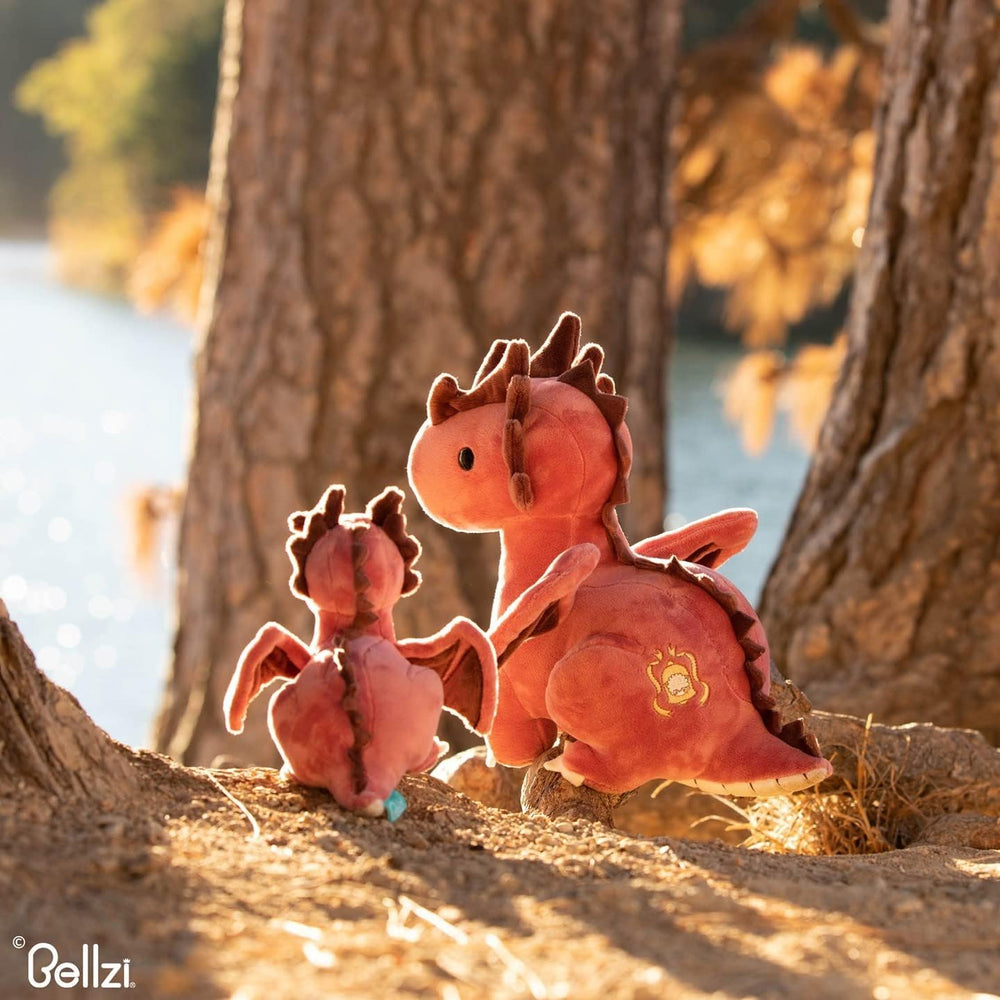 Dragon toy resting on a child’s pillow during nap
