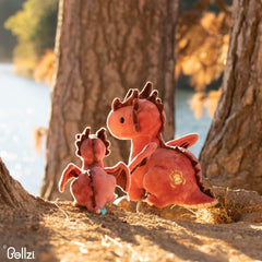 Dragon toy resting on a child’s pillow during nap