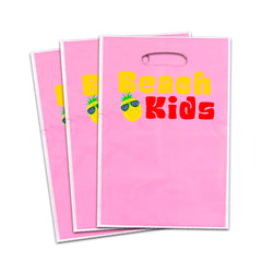 Pink Beach Kids loot bags paired with Gabby's Dollhouse favors for gift presentation.