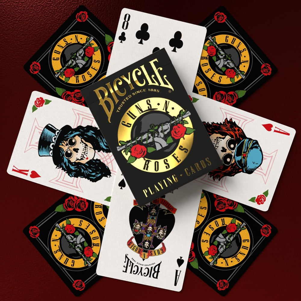 Friends playing cards with Bicycle Guns N' Roses deck adding rock-themed atmosphere