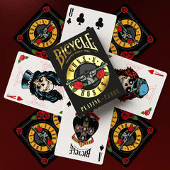 Friends playing cards with Bicycle Guns N' Roses deck adding rock-themed atmosphere