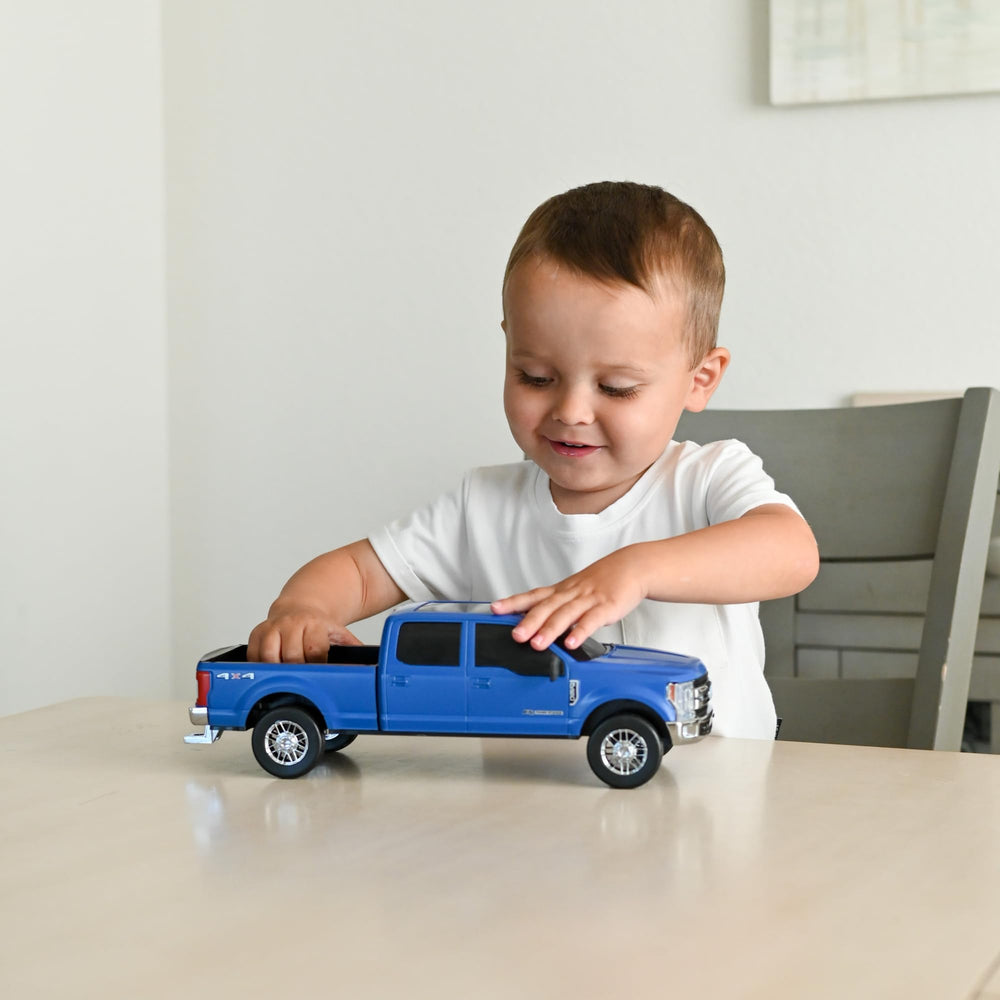 Big Country Toys Ford F250 tailgate folds down for loading during play.
