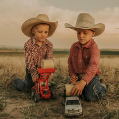 Big Country Toys interchangeable bucket and hay fork attachments.