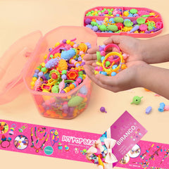 Biranco Pop Beads kit child wearing a bracelet crafted from snap beads.