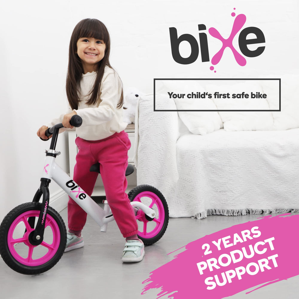 Bixe pink back view balance bike shows compact storage after use.
